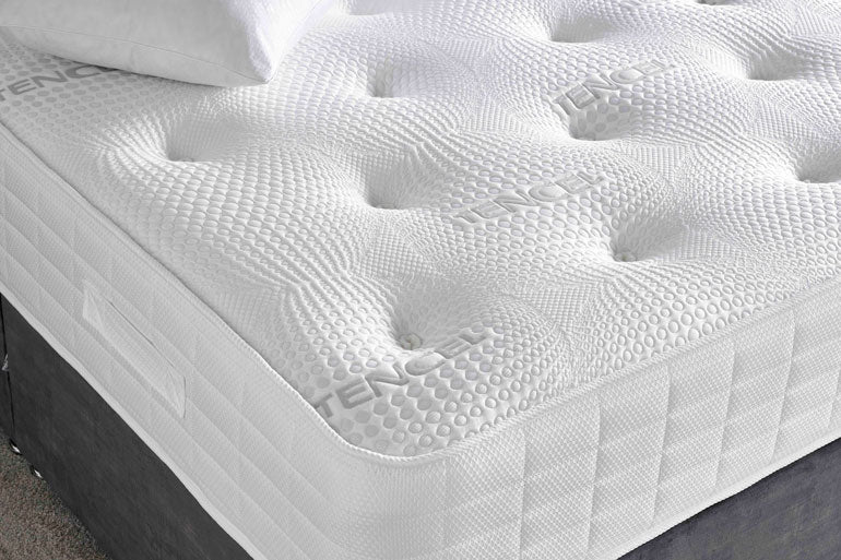Close-up of Deep Sleep Sapphire 2000 Mattress on grey divan base