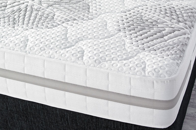 Close-up of a Tranquilty 2000 Pocket memory foam mattress on a divan base