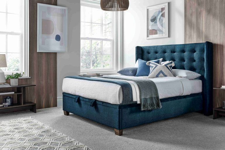 Side view of Kaydian Brunton Ottoman Bed Vogue Ocean in contemporary bedroom setting.