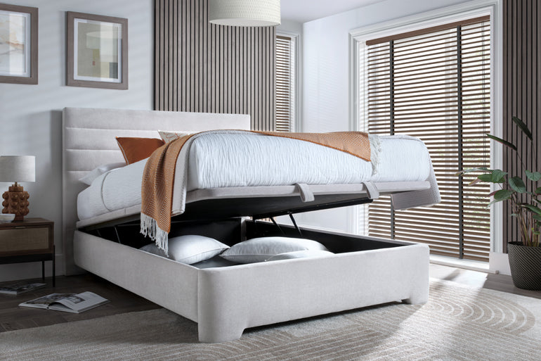 Kaydian Appleby Ottoman Bed in Maskat Clay with storage open in bedroom.