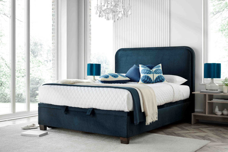 Kaydian Clifton Ottoman Bed in Vogue Ocean in bedroom setting.