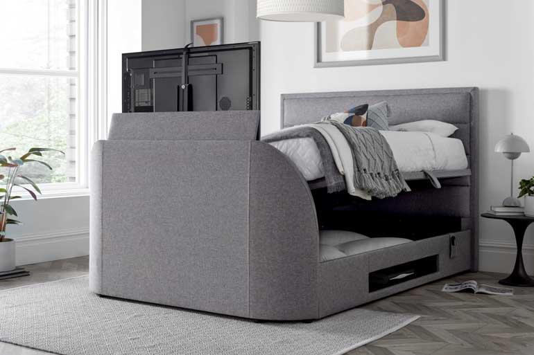 Kaydian Kirkby | Kirkley TV Ottoman Bed showing TV compartment open in bedroom setting.