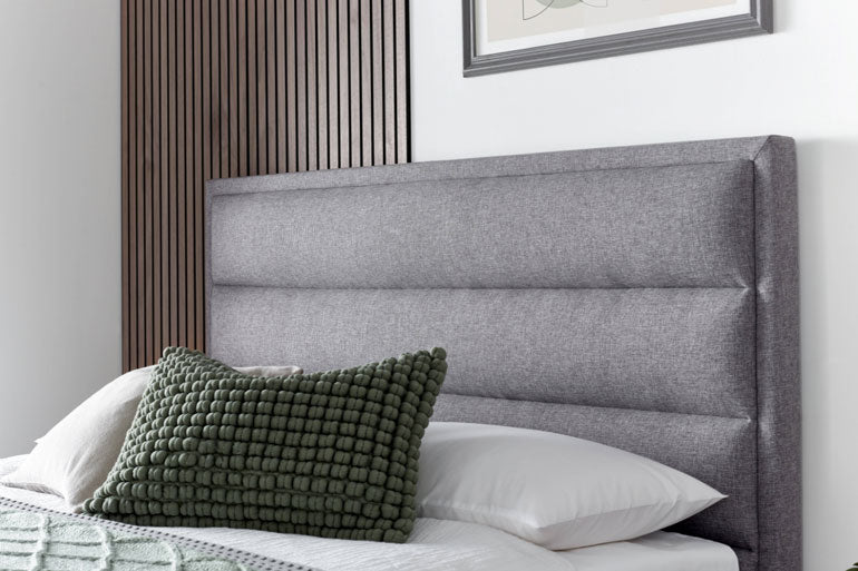Close-up of Kaydian Kirkby Ottoman Headboard in Marbella Grey.