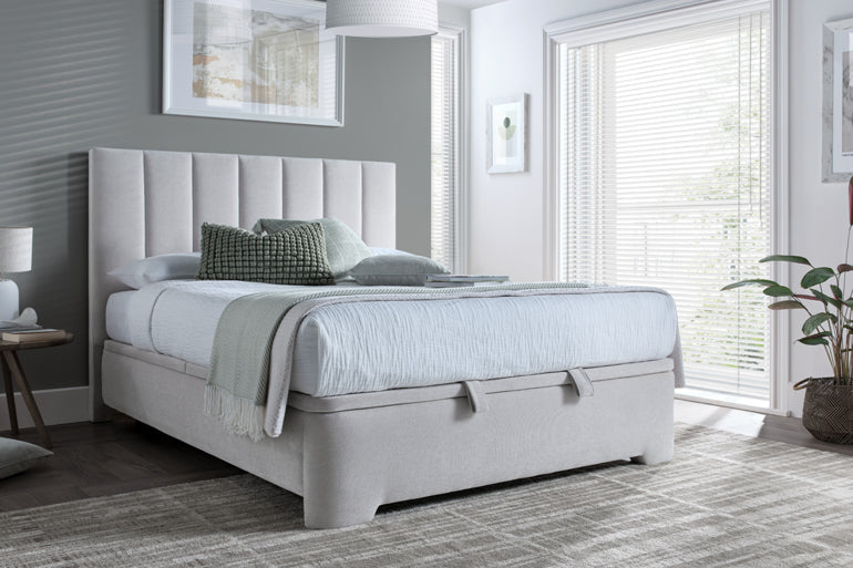Kaydian Medburn Ottoman Bed in Maskat Clay in modern bedroom with white bedding.