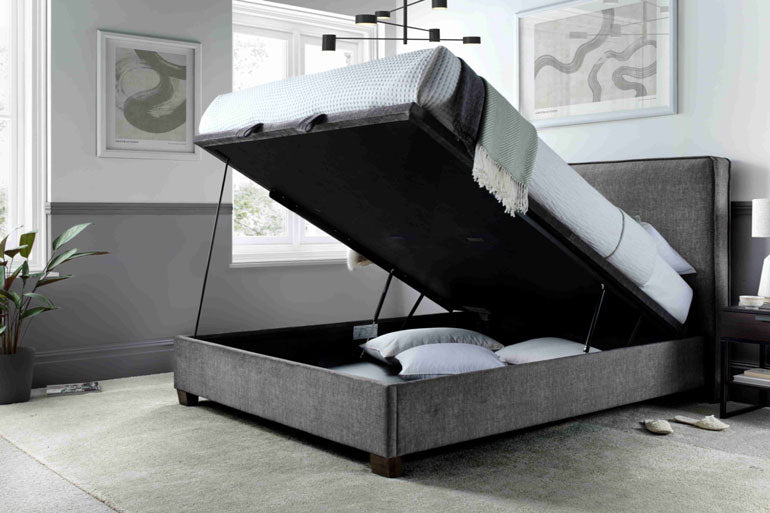Kaydian Newton Ottoman Bed in Vogue Ocean Blue with the storage compartment open.