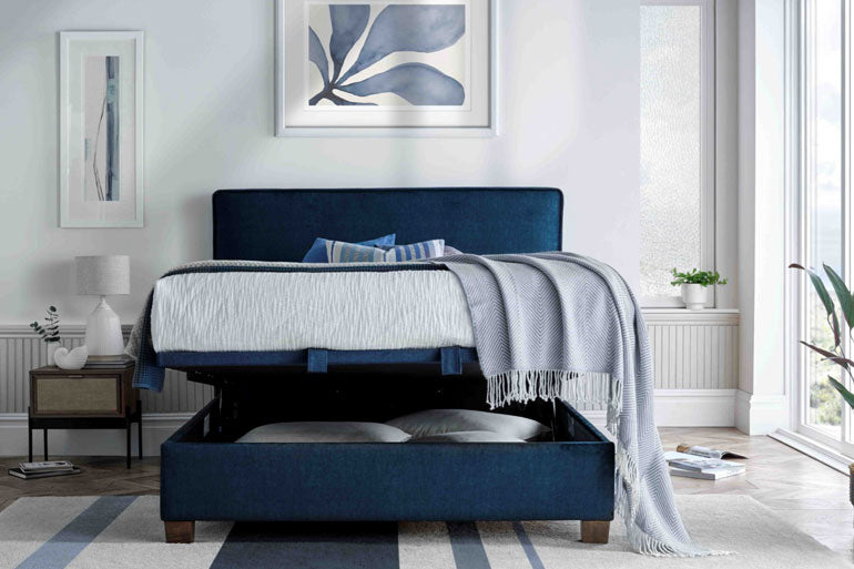 Kaydian Newton Ottoman Bed in Vogue Ocean Blue showing the storage compartment partly open.
