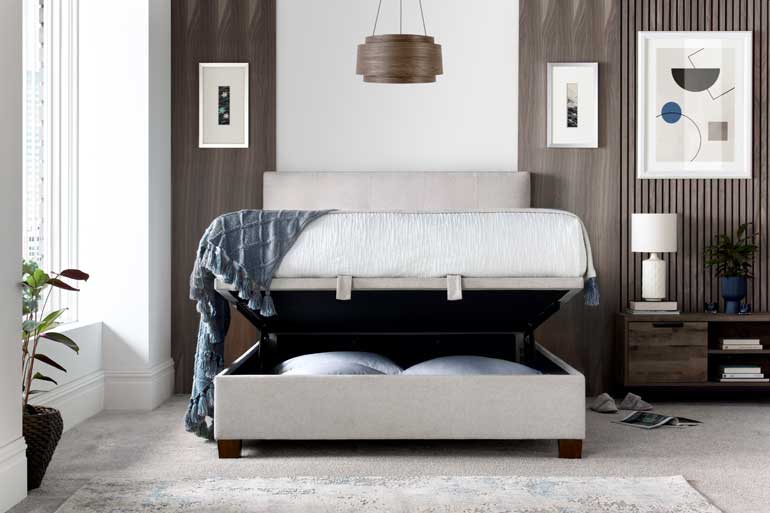 Kaydian Walkworth Ottoman Bed in Maskat Clay with storage compartment open in modern bedroom.