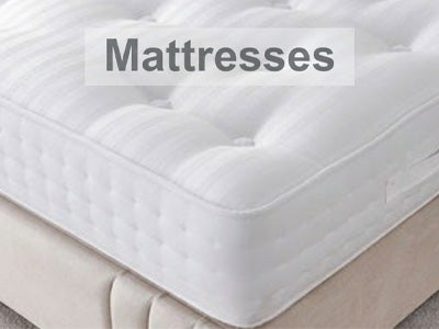 White mattress with 'Mattresses' text overlay on a gray background