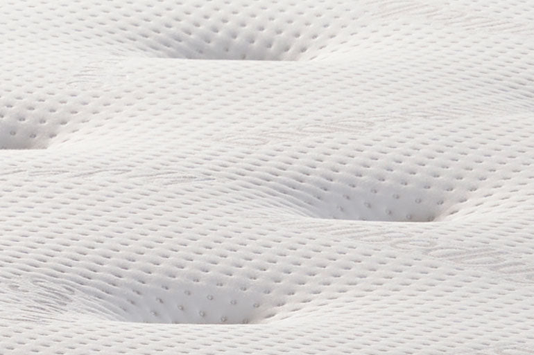 Close-up of a white mattress with a textured surface