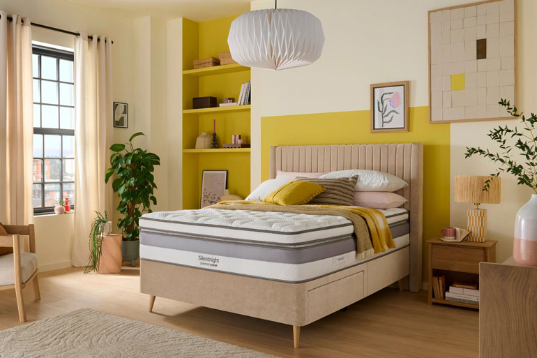 Bedroom setting with a Silentnight Memory Cool 3000 Boxtop Mattress on a beige winged bed.