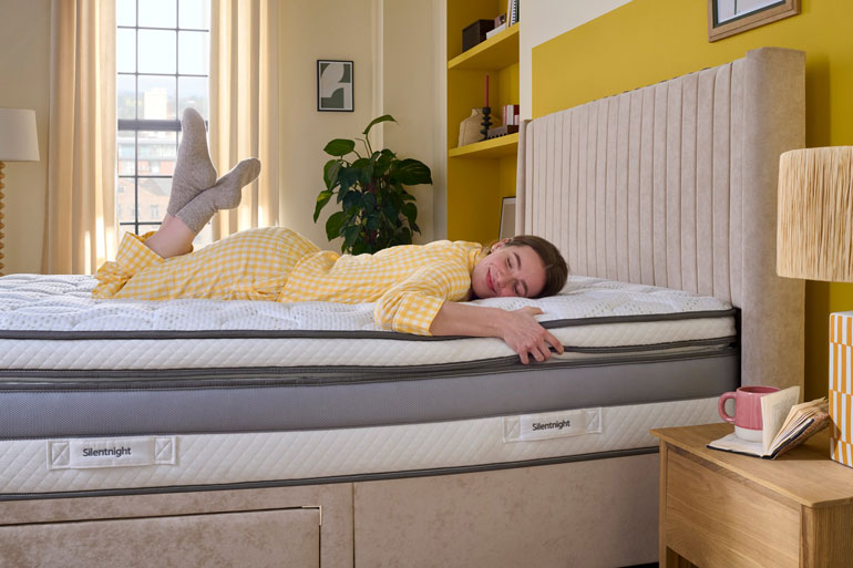 Woman laid on her front on a Silentnight Memory Cool 3000 Boxtop Mattress