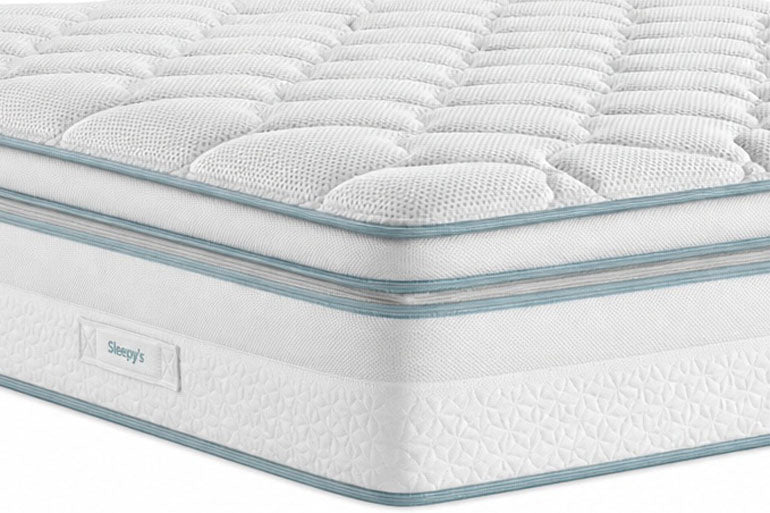 White mattress with blue stitching details on a white background