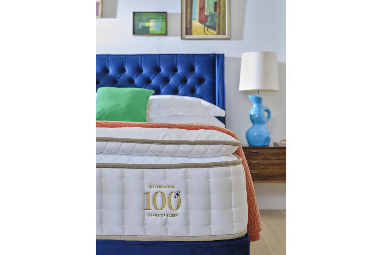 Close up of corner of mattress on divan base