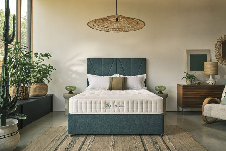 Natural Wool Luxe 1200 Mattress on a green divan bed base with a headboard