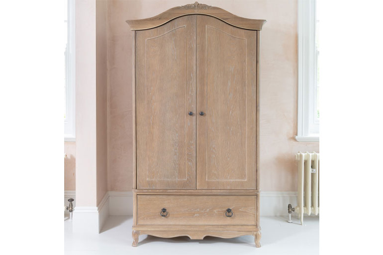 Willis & Gambier Camille Wooden wardrobe with two doors and a drawer in a room with a radiator.