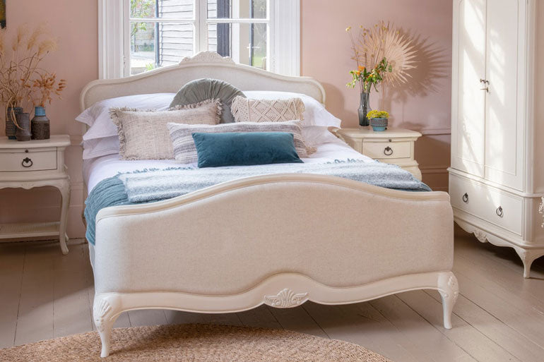 Willis & Gambier Ivory Upholstered Bed in bedroom setting with bedsides and wardrobe.