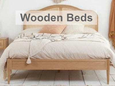 Wooden bed in a bedroom with 'Wooden Beds' text overlay