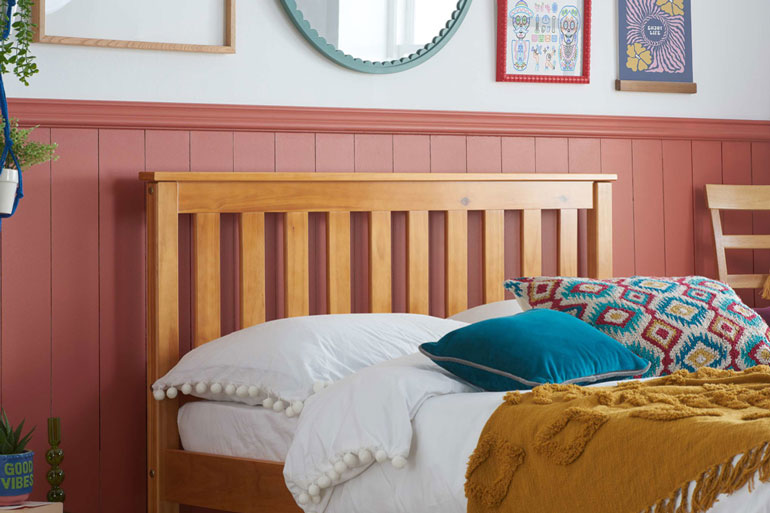 Close-up of Birlea Denver Wooden Bed on Pine on panelled background