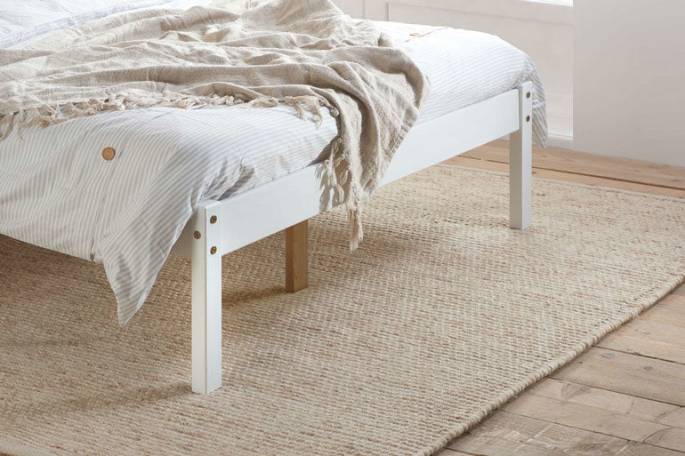 Birlea Denver footend in white on rug.