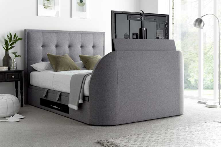 Kaydian Falstone | Falmer TV Ottoman Bed in Marbella Grey with the TV compartment open.