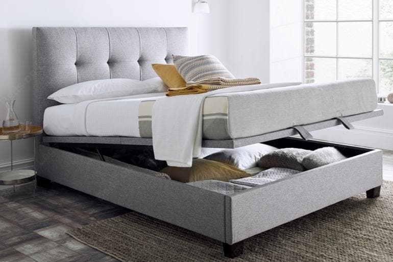 Kaydian Walkworth Ottoman Bed in Marbella Grey with storage compartment open.