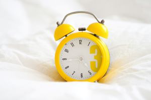 A yellow alarm clock