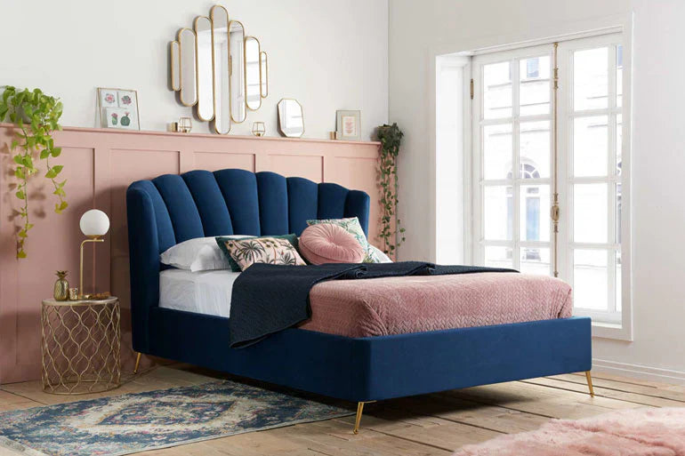 Upholstered bed in blue fabric