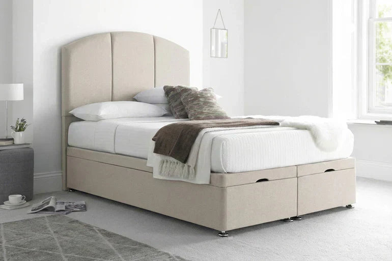 upholstered bed with a curved headboard
