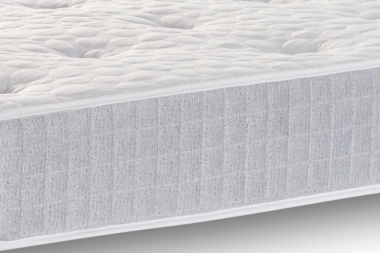 Close-up of side of a Classic Sprung mattress with a textured cover.