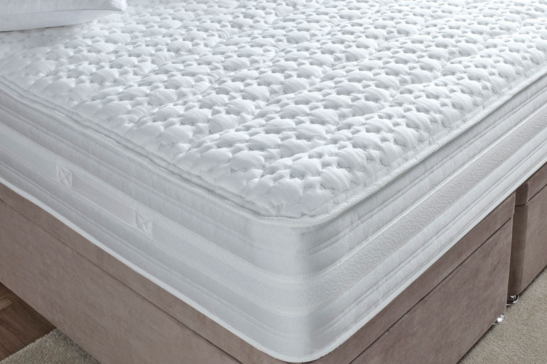 Corner view of Cameo 1000 matters on divan base