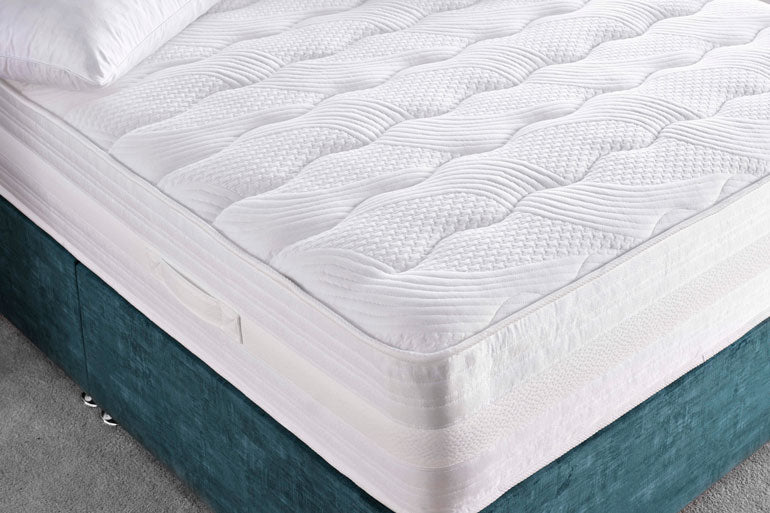 Corner view of Deep Sleep Supreme 1000 Mattress on divan base