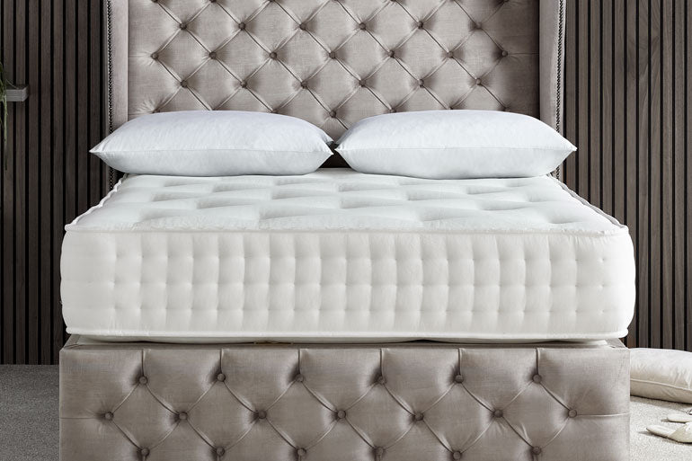 Giltedge Backcare 2000 Mattress on a bed with headboard and footboard in a bedroom setting