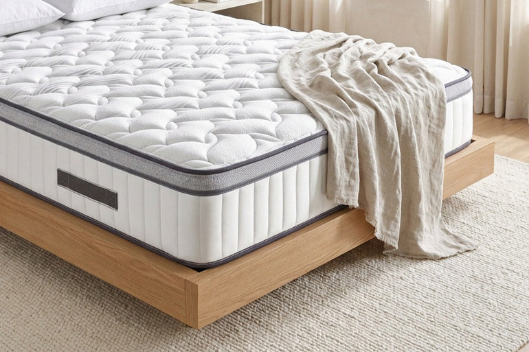 Close-up of corner of mattress in bedroom