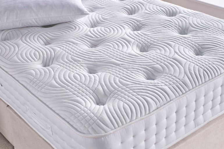 Close-up of Giltedge Symphony 1000 Mattress on divan base