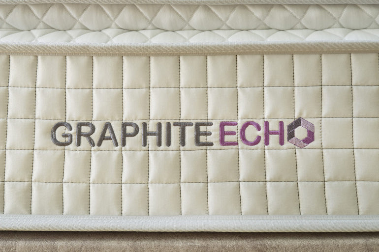 Quilted fabric surface with 'Graphite Echo' logo embroidered on it