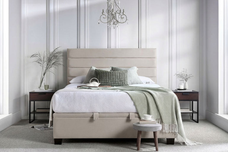 Kaydian Appleford Ottoman Bed with white bedding and green blanket in a stylish bedroom.