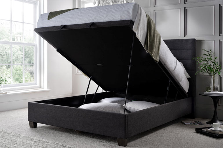 Kaydian Appleford Ottoman Bed in Slate with storage compartment open in a bedroom.