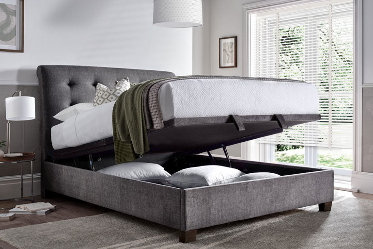 Kaydian Ashbrooke Ottoman Bed with storage compartment open in a bedroom setting.