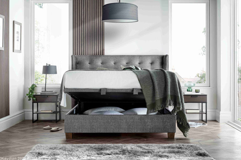 Kaydian Brunton Ottoman Bed in Vogue Grey with the storage compartment slightly open.