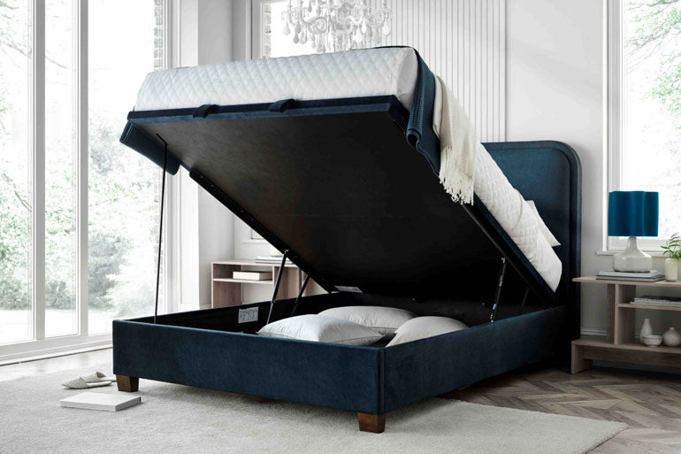 Kaydian Clifton Ottoman Bed in Vogue Ocean Blue showing the storage compartment open.