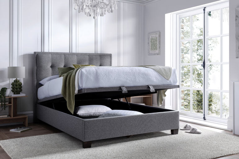 Kaydian Falfield Ottoman Bed in Marbella Grey with storage compartment in a bright bedroom