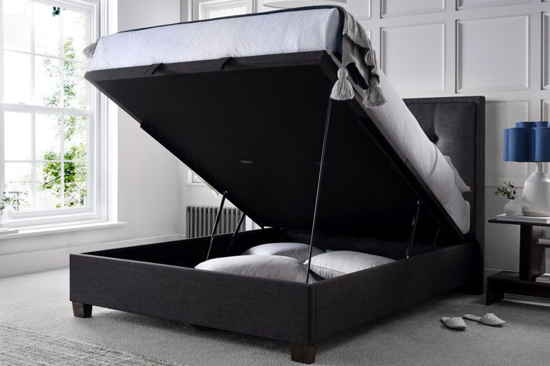 Kaydian Falfield Ottoman bed in Slate with open storage compartment in a bedroom setting.