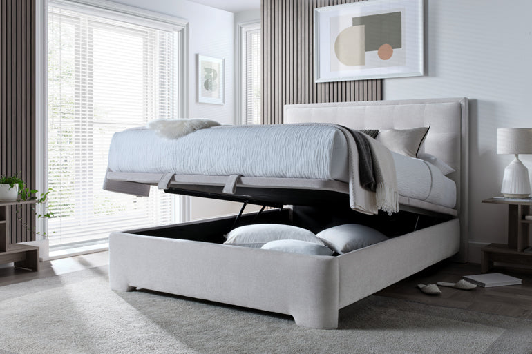 Kaydian Falstone Ottoman Bed with storage compartment open in a modern bedroom.