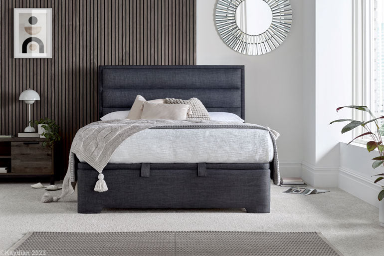 Kaydian Kirkby Ottoman Bed in Slate in bedroom setting with white bedding.