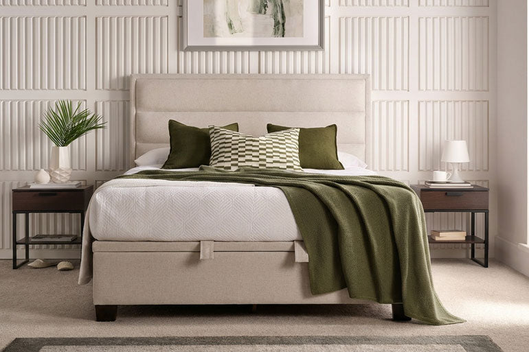 Kaydian Kirkland Ottoman bed with green bedding in a bedroom setting.