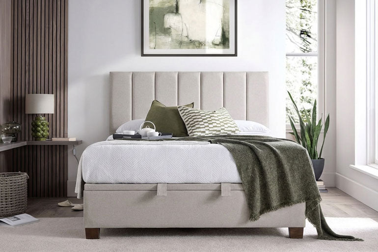 Bedroom featuring a Kaydian Medlam Ottoman Bed in Maskat Clay with a green blanket.