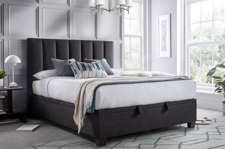 Bedroom with a Kaydian Medlam Ottoman Bed in with white bedding in bedroom setting.