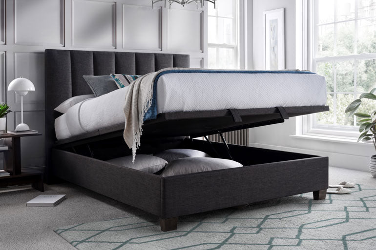 Kaydian Medlam Ottoman Bed with storage compartment open in a bedroom setting