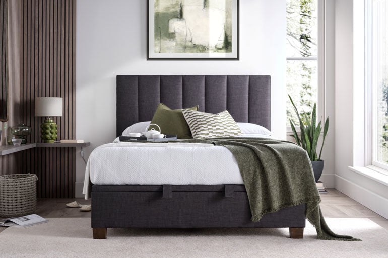 Kaydian Medlam Ottoman Bed in Slate with white bedding in a bright bedroom setting.