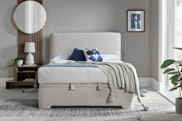 Kaydian Newland Ottoman bed in a bedroom setting with decor elements.